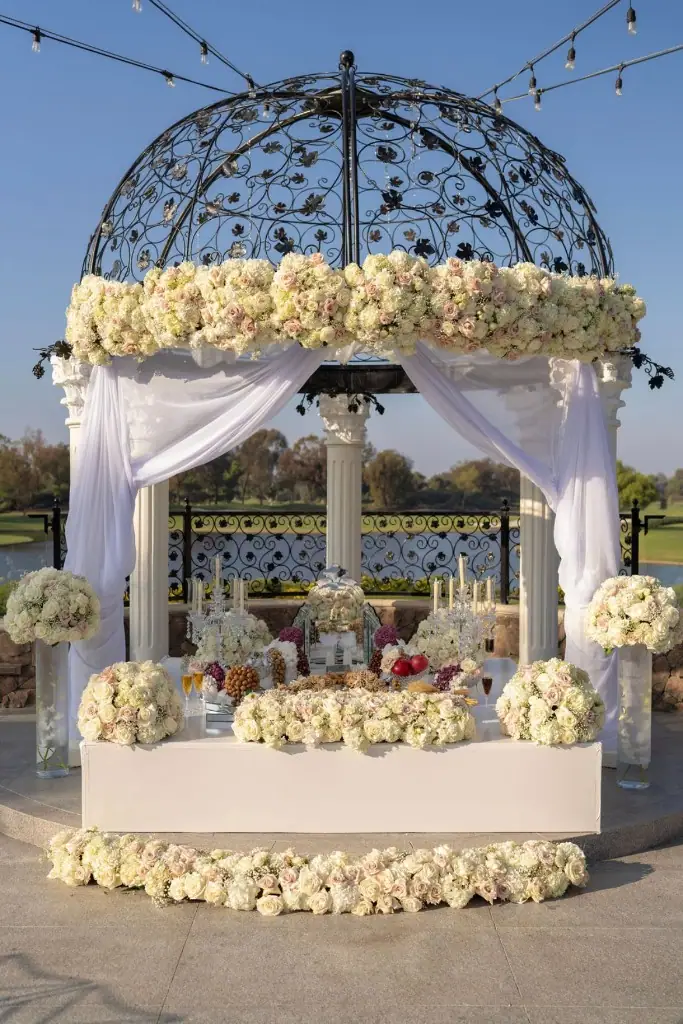 Outdoor Sofreh Aghd gazebo draped in white and blush florals
